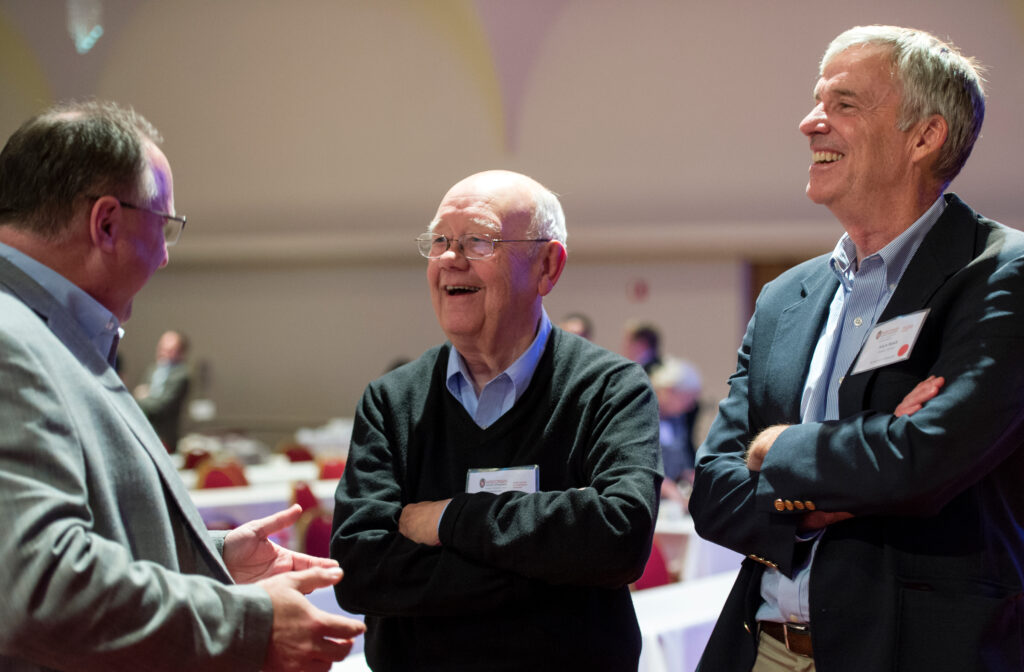 three board members talking