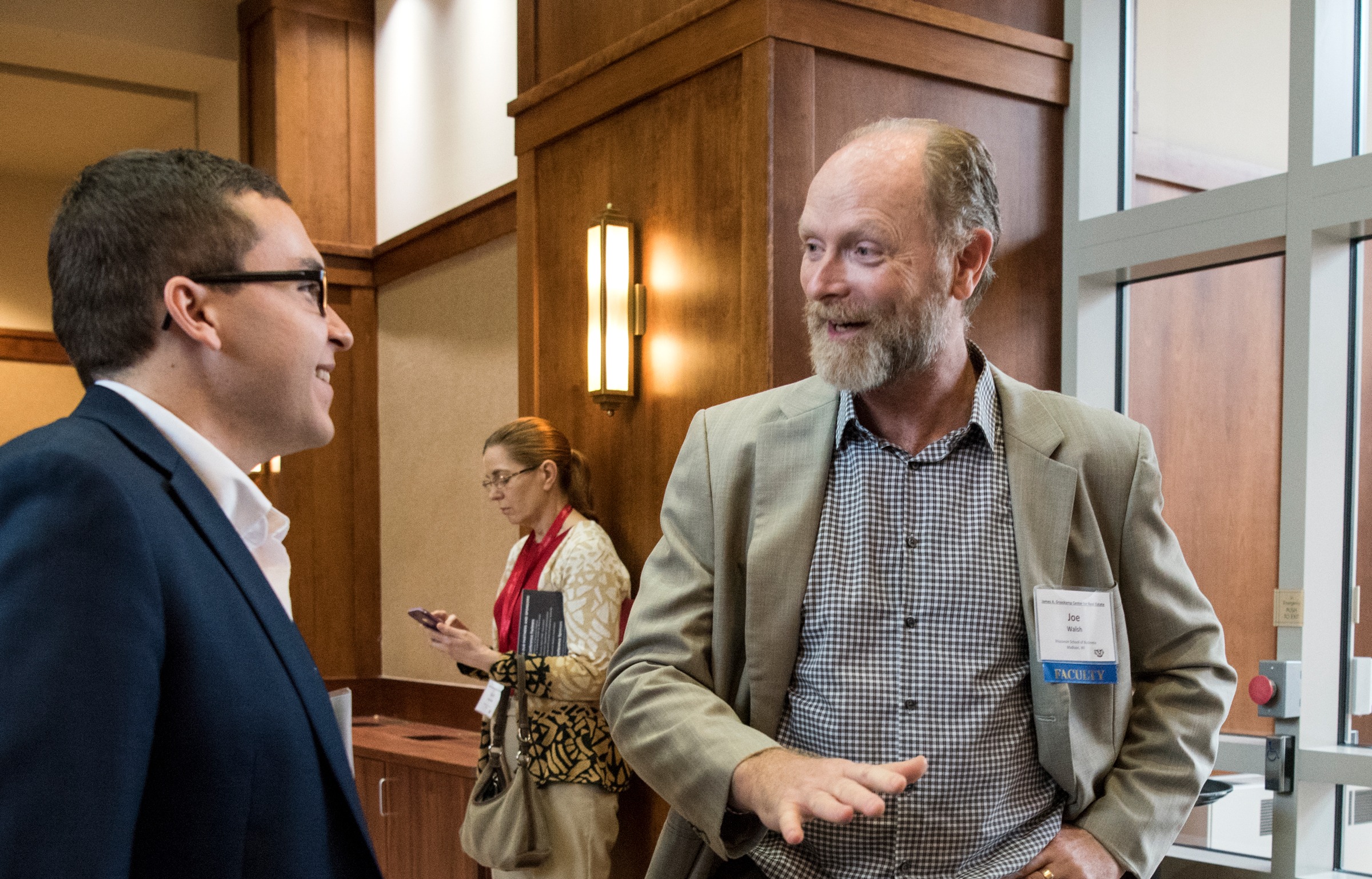 two people talking at conference