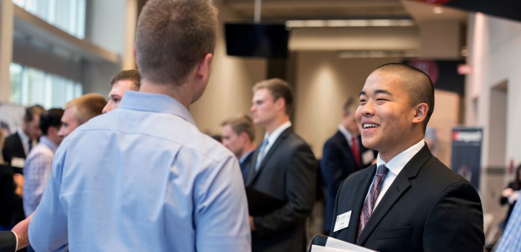 people talking at job fairs