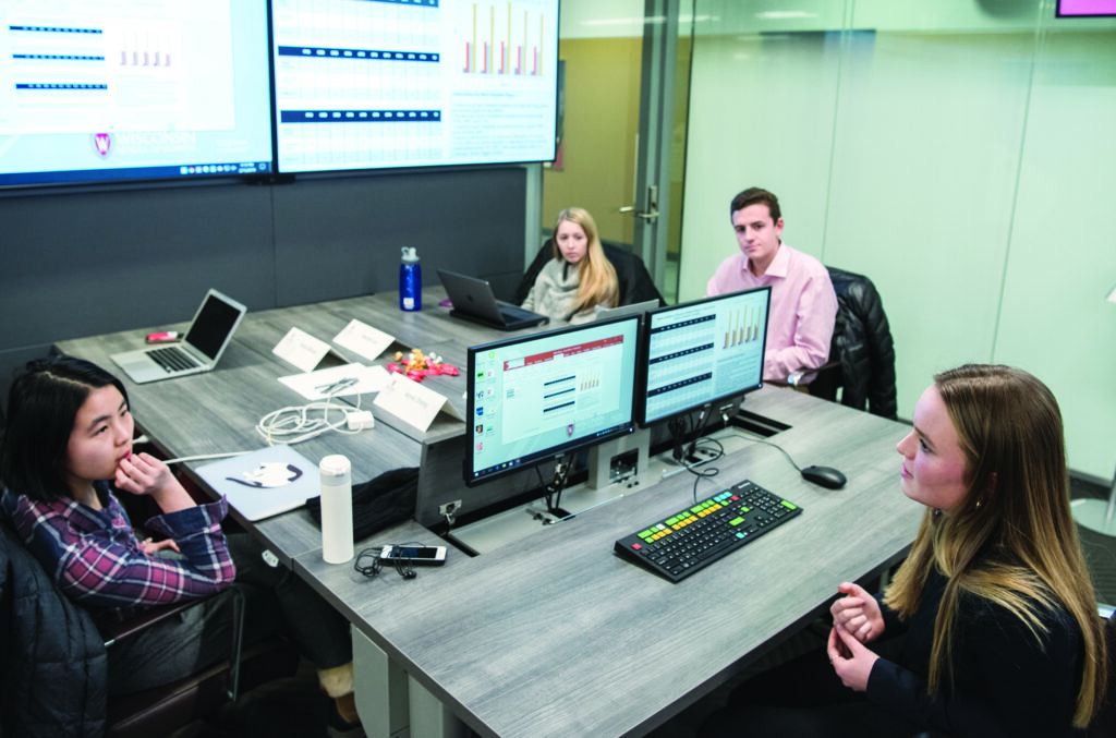 Students collaborating over computers