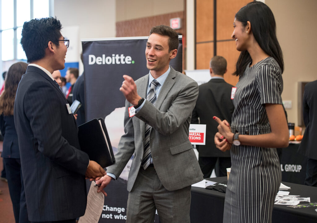 Student networking at a career fair