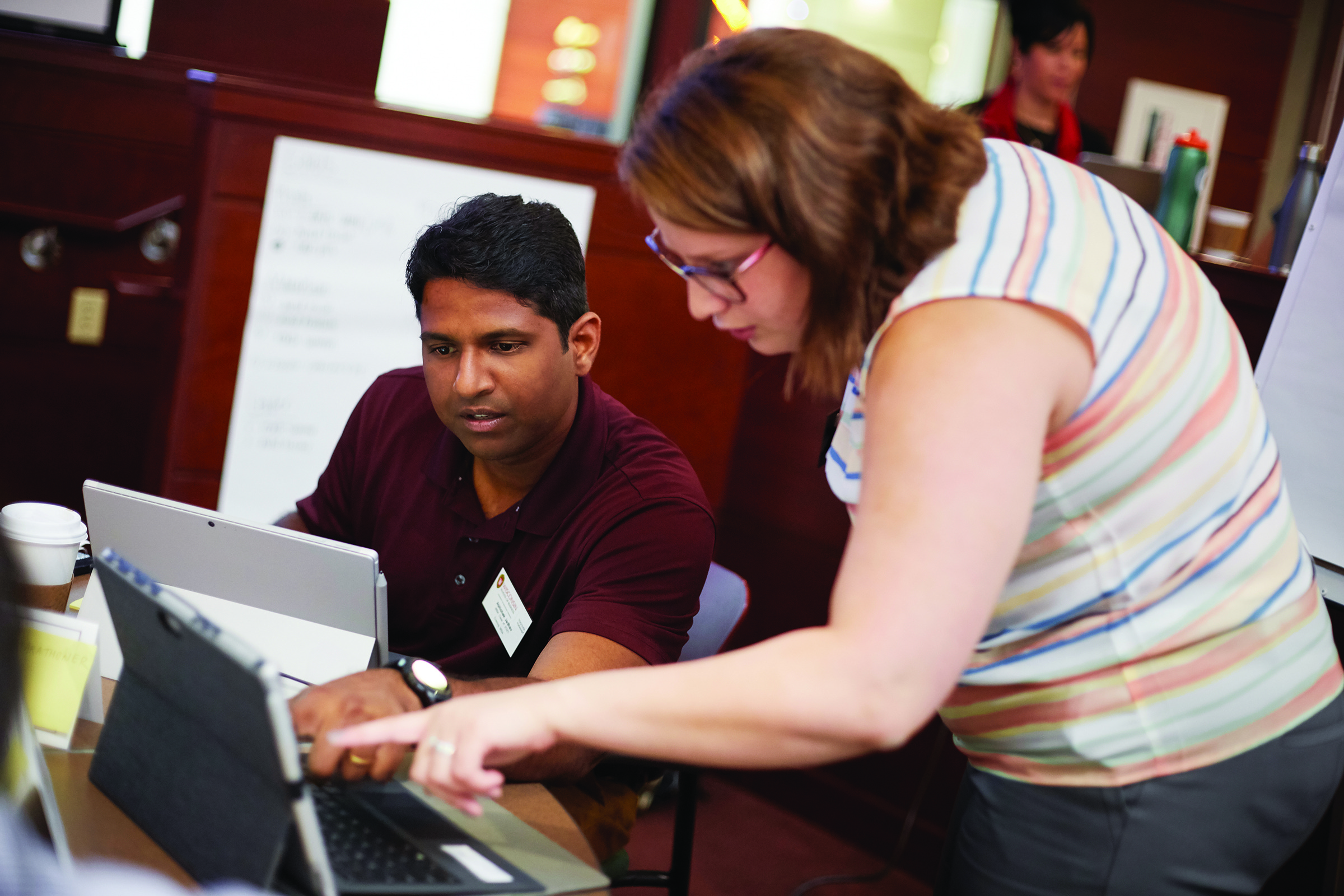 Students collaborating over computers