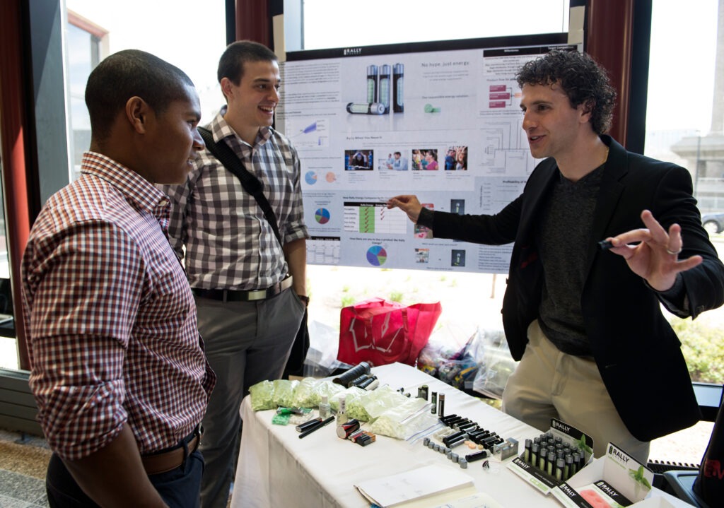 A man making a presentation two people