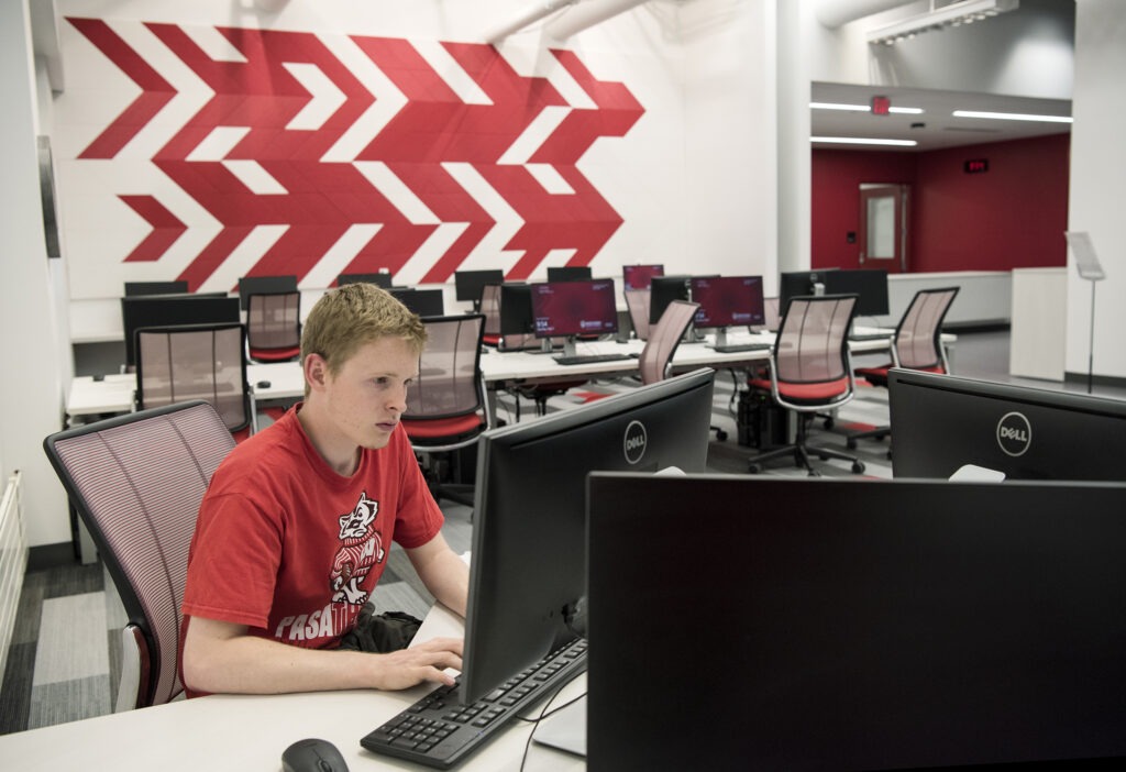 BBA student studying for his finals on the first floor of the new Learning Commons.