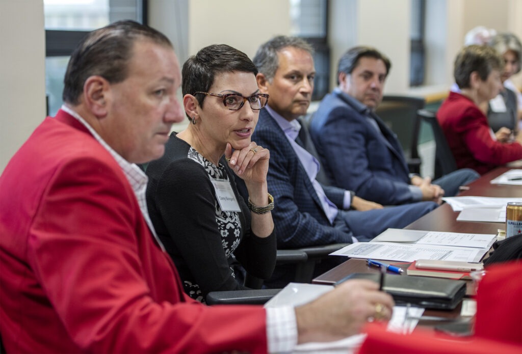 Board members talk at a meeting