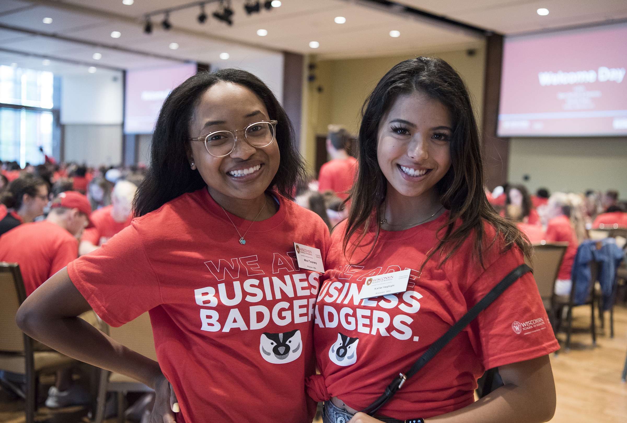 2 students smiling in Business Badger shirts