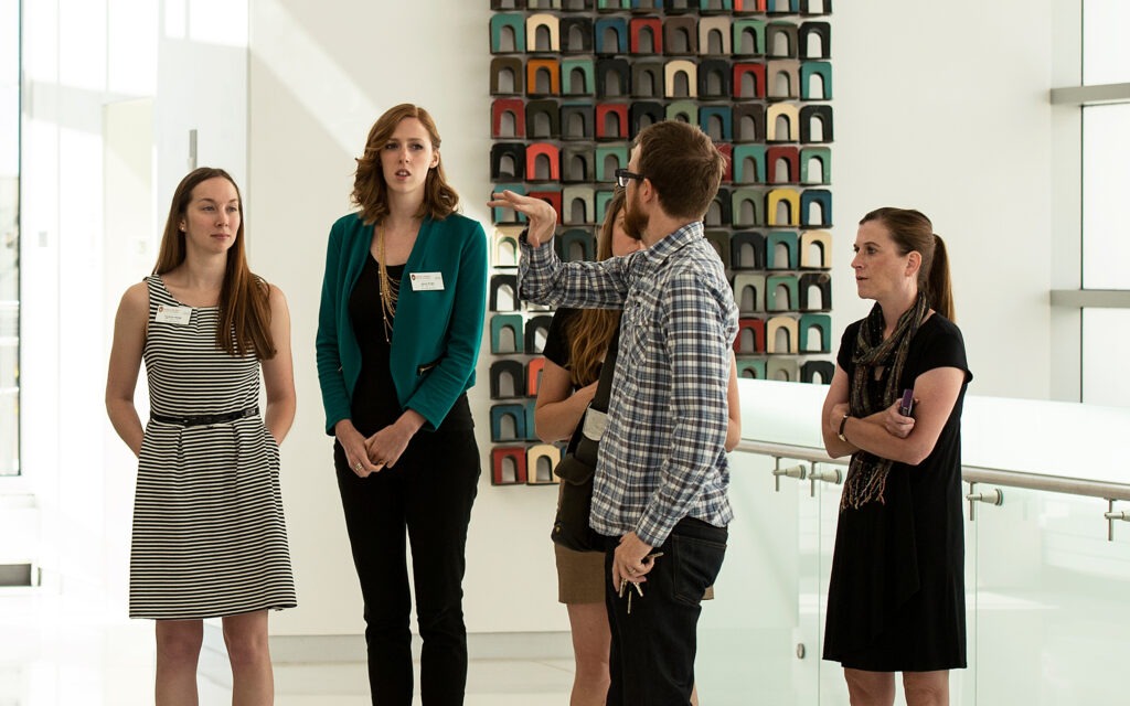 Students talking with center leaders at orientation