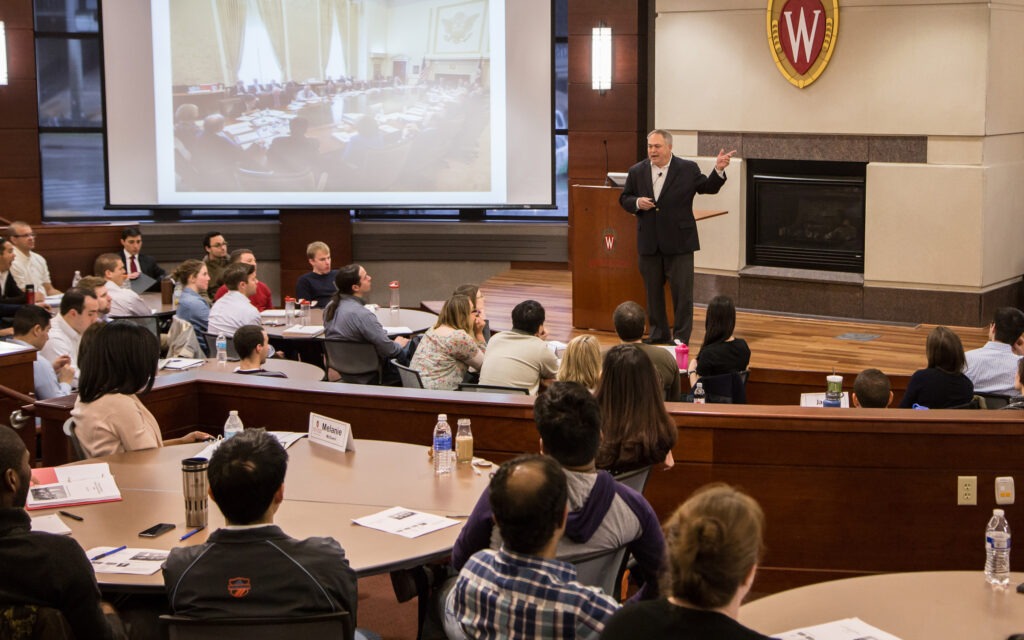 A speaker addresses students in Grainger Hall