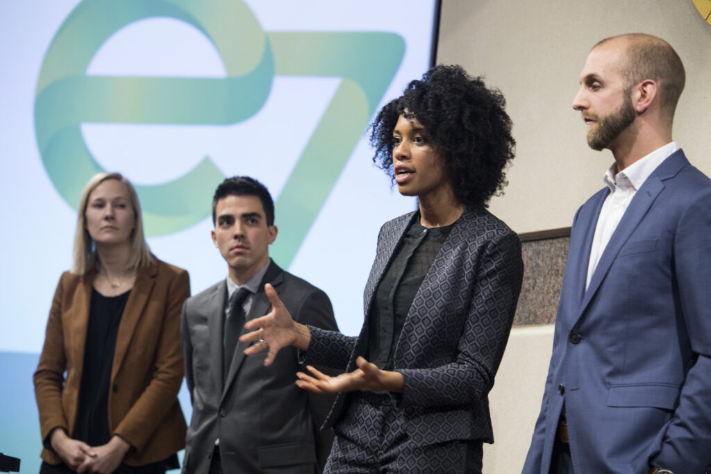 A woman presents the team project during the Case Competition