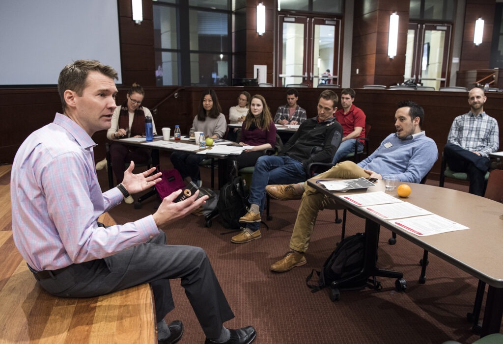 Students listening to leadership symposium