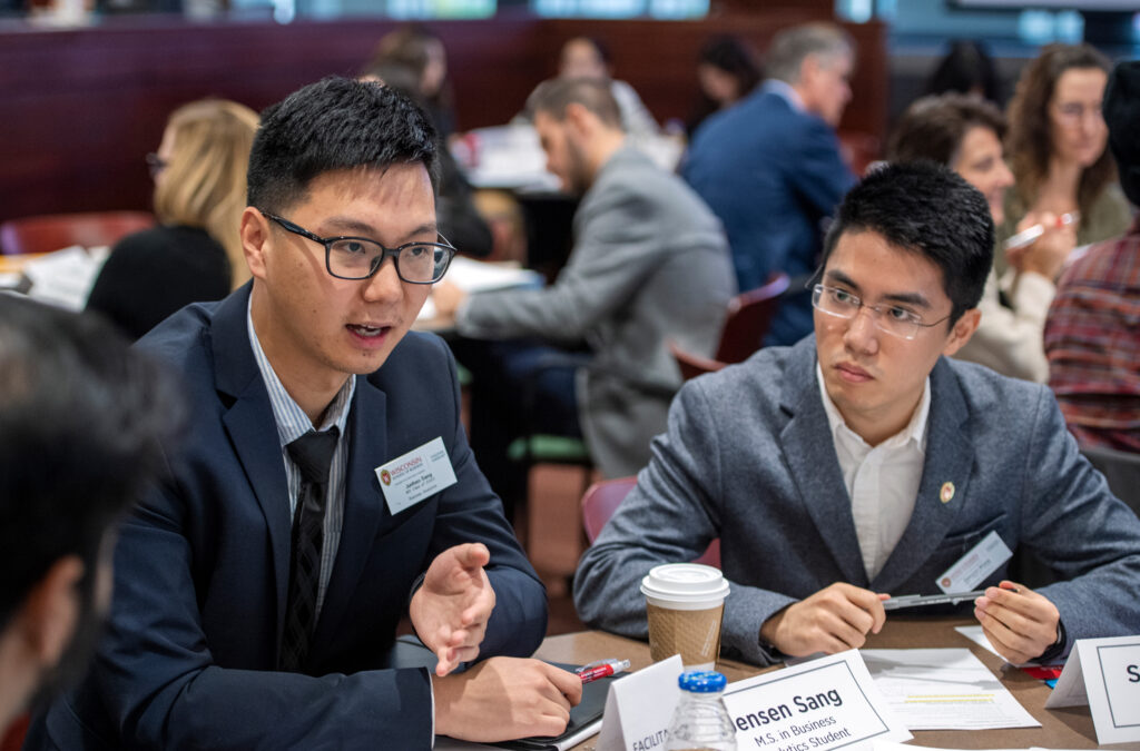 students talking at industry meetup