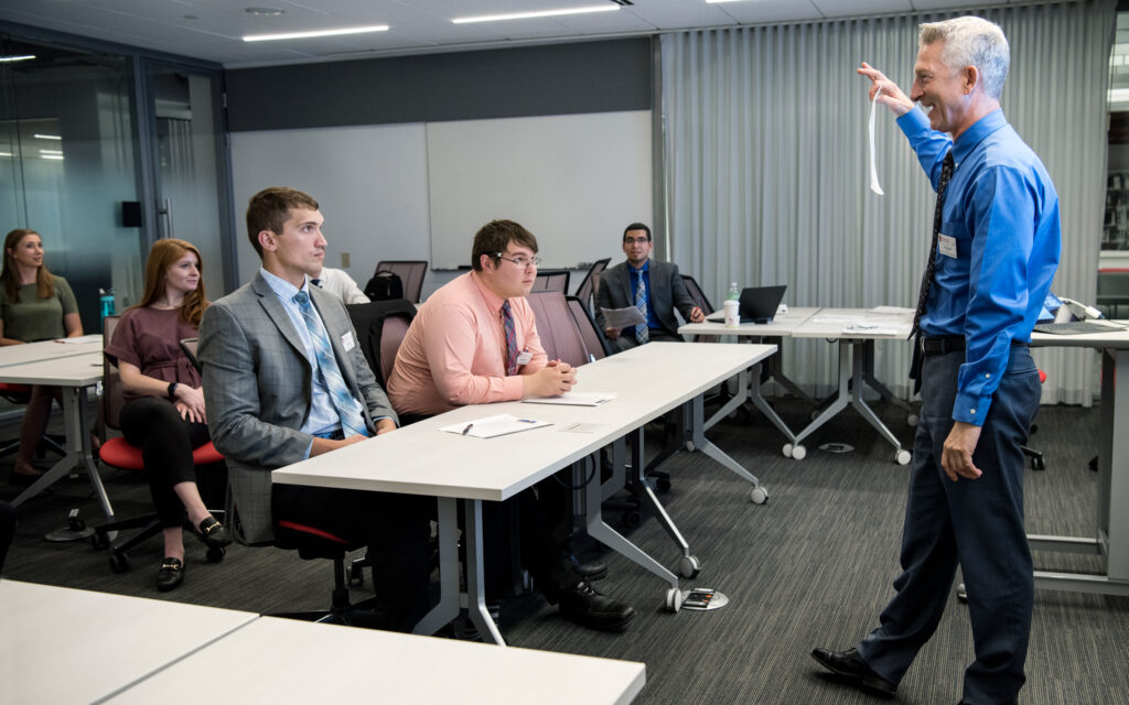 Students listening to a speaker in class