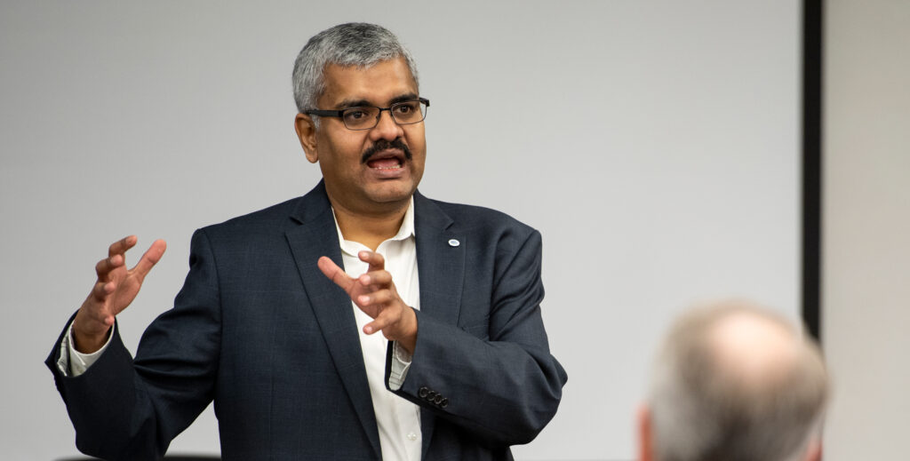 Man speaking in front of audience