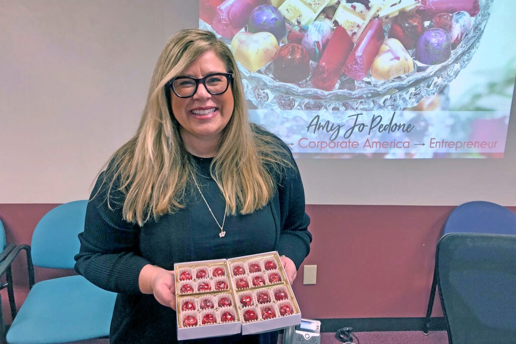 Amy Jo Pedone holding cupcakes