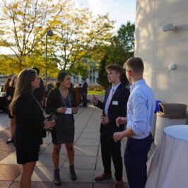 Four people speaking in a group