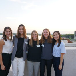 Five women smiling at the camera