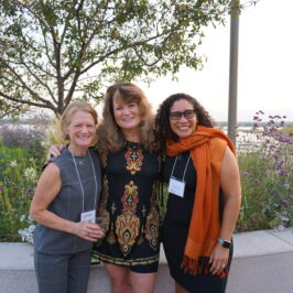 Three woman smiling at the camera