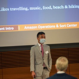 A man presenting in front of a group of people