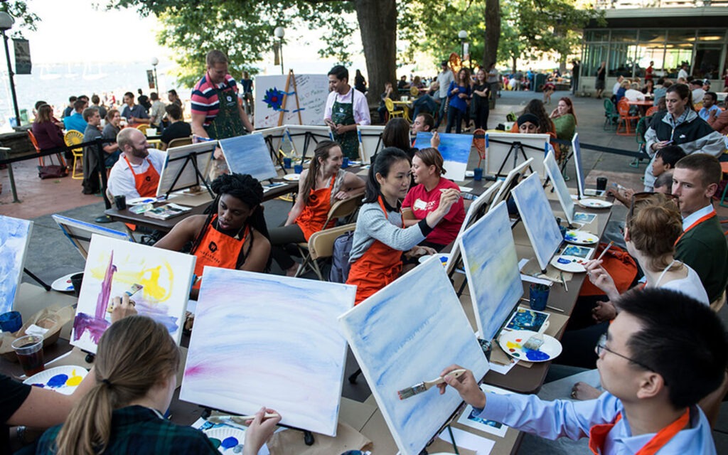 Students painting on the terrace.