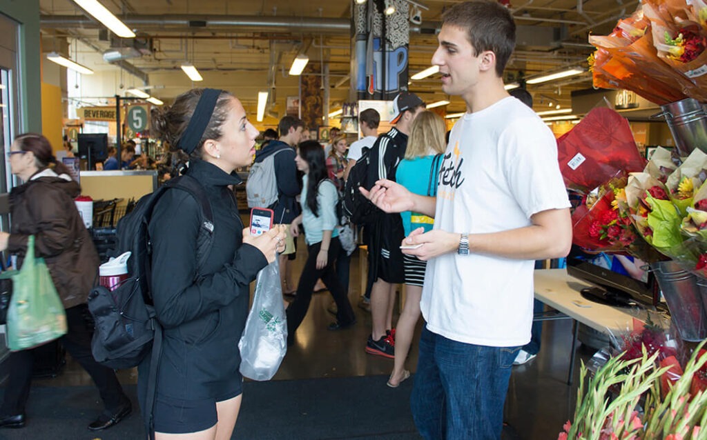 Tyler Kennedy speaking with someone at a store.