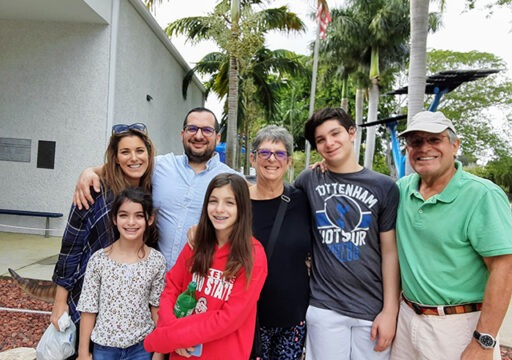 Martin Feldman taking a photo with his family