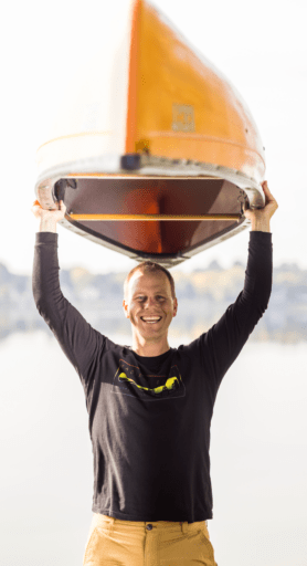 Tyler Leeper holding a canoe