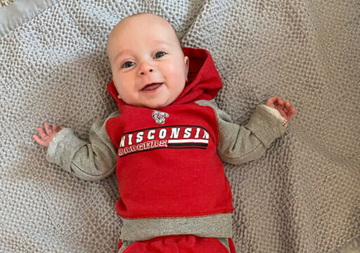 Baby wearing Wisconsin hoodie