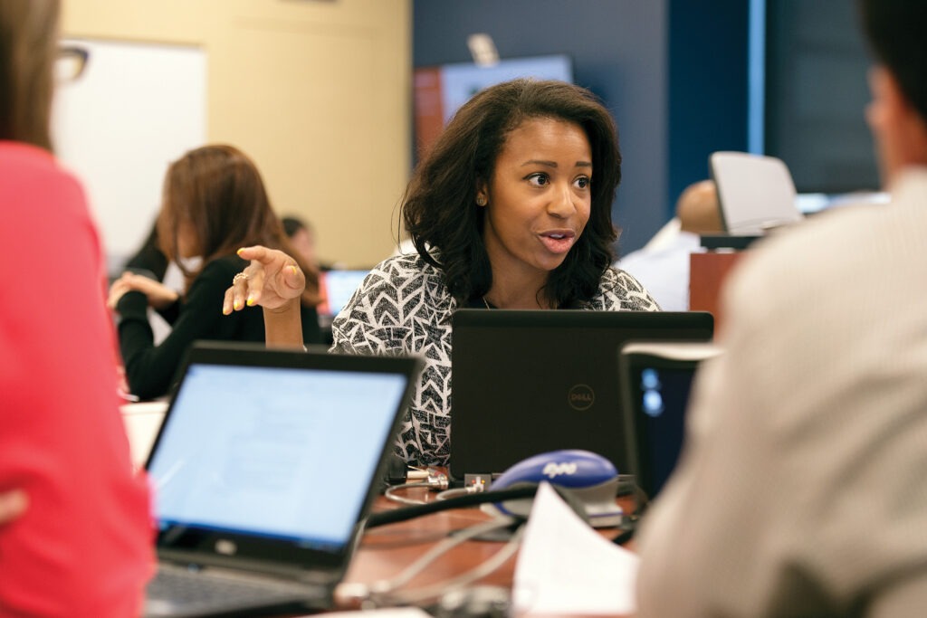 Students talking over computers