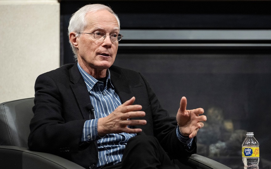Scott Cook shares insights on stage during a Weikel talk