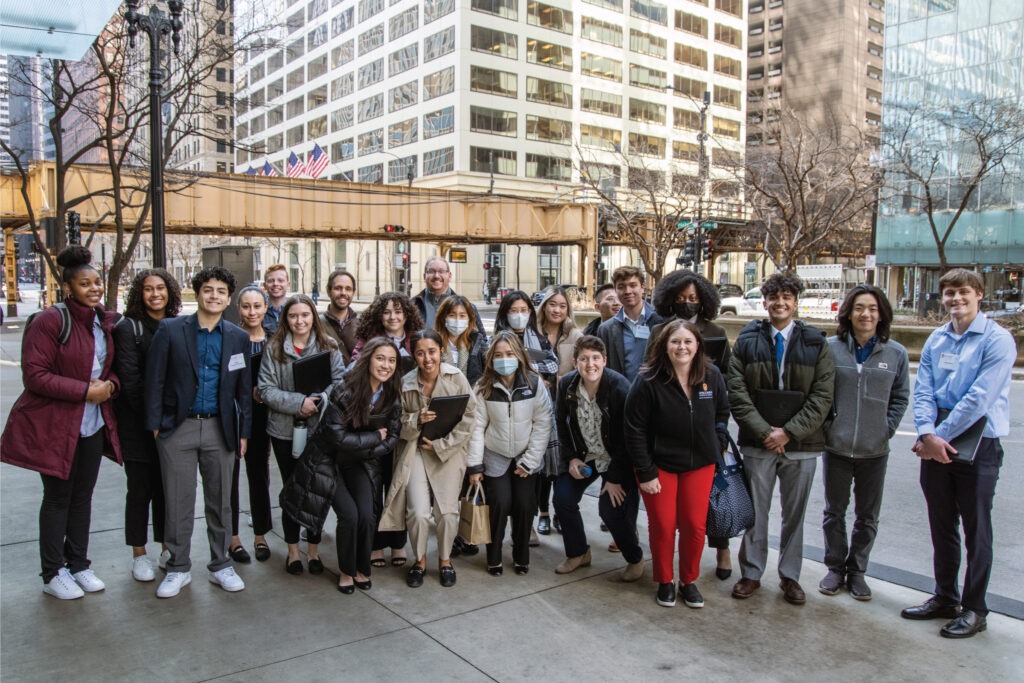 Group of students posing on the sidewalk