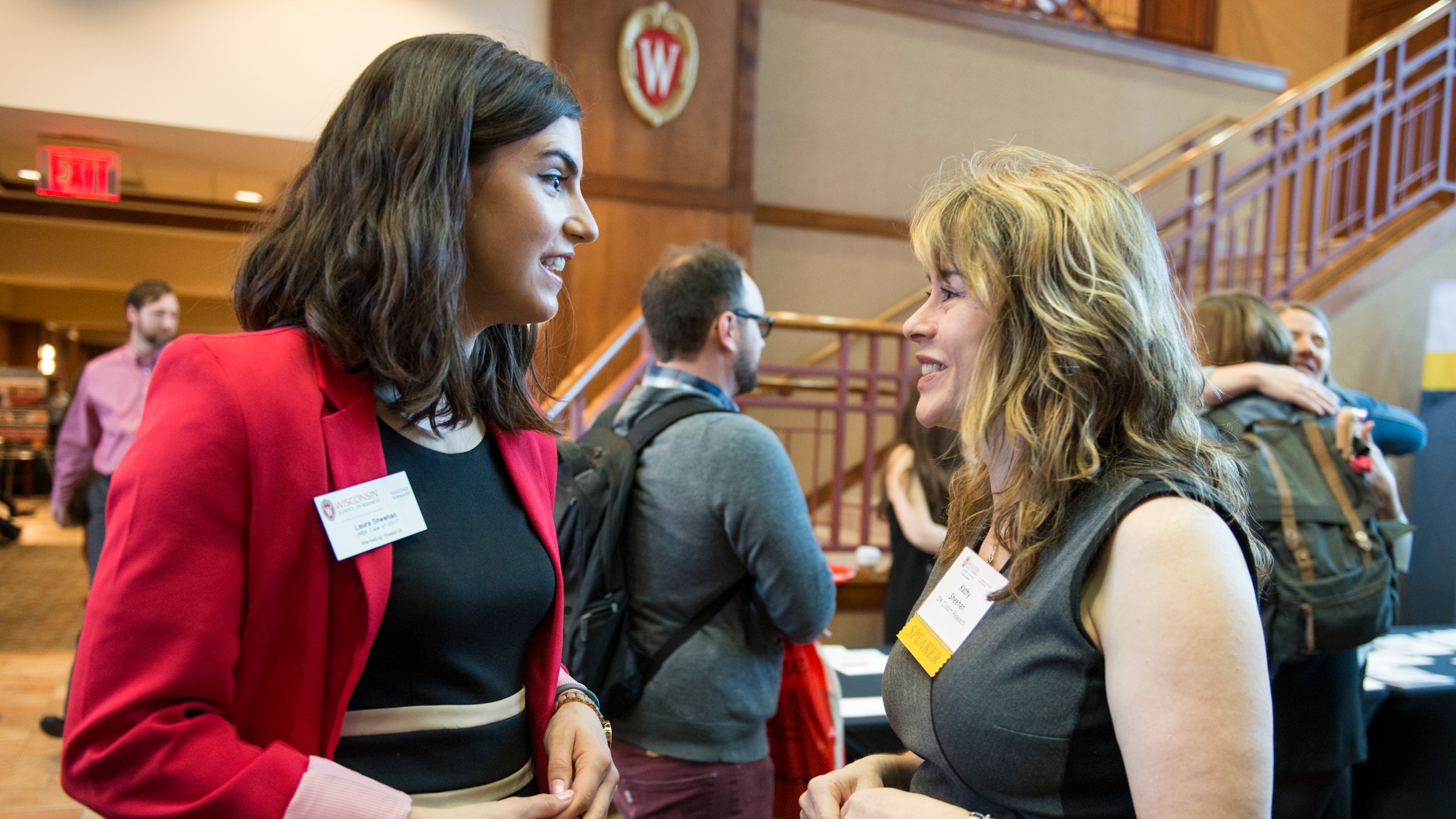 Conference attendee chatting with speaker