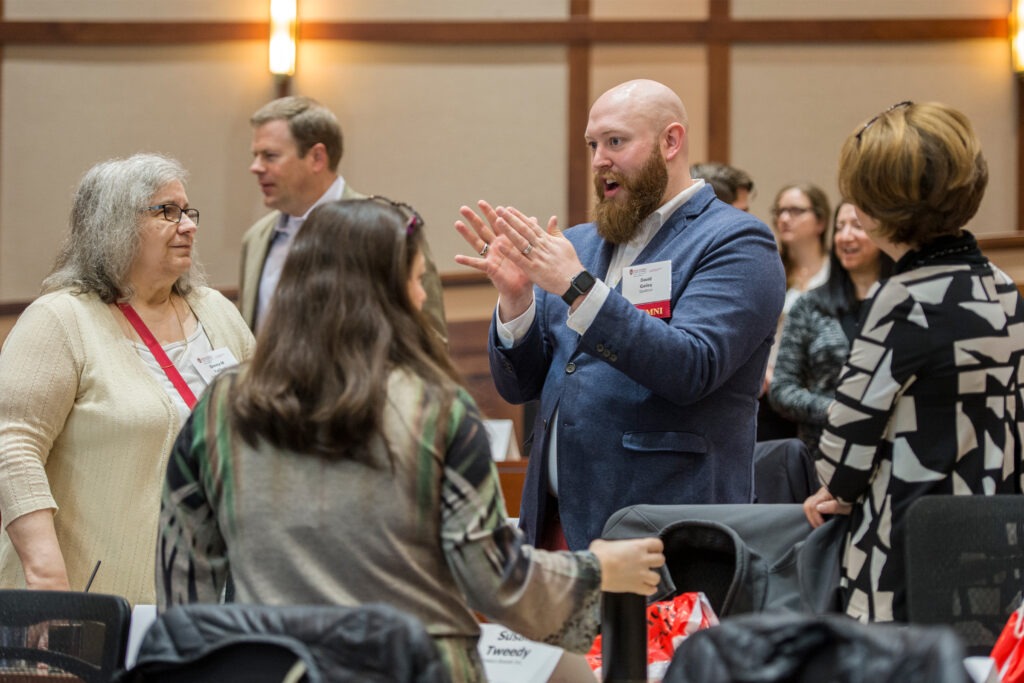 Marketing Summit attendees network between conference sessions