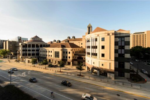 View of Grainger Hall at sunrise from University Avenue