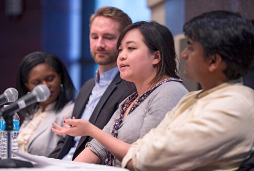 MBA students speaking at a panel event
