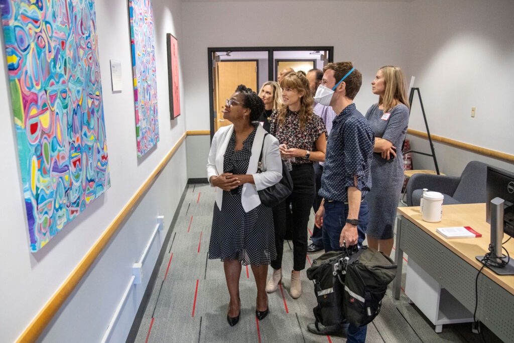 Attendees view art in the new Multicultural Center at the Wisconsin School of Business.