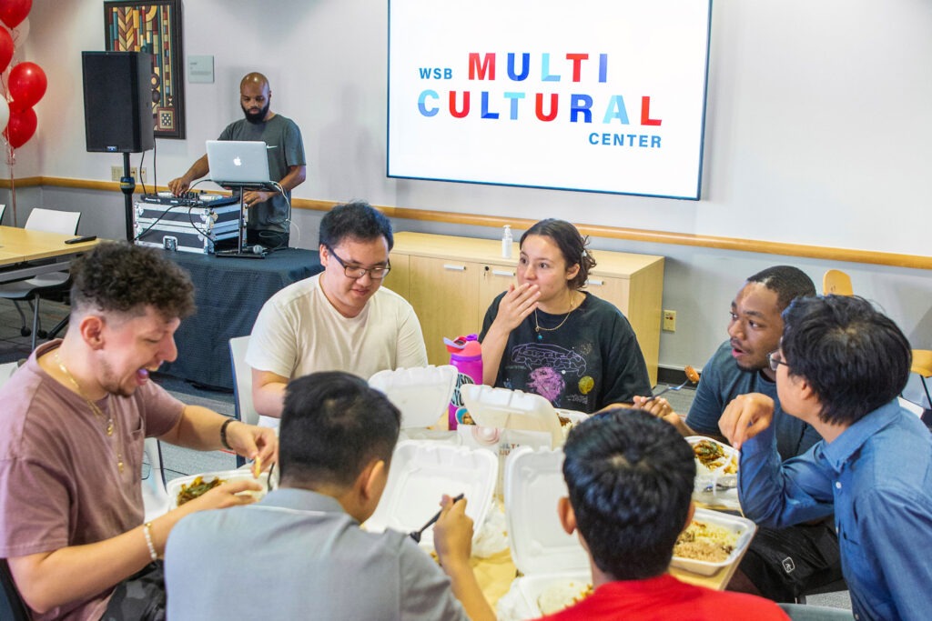 A group of students enjoy food and entertainment at the Multicultural Center grand opening.