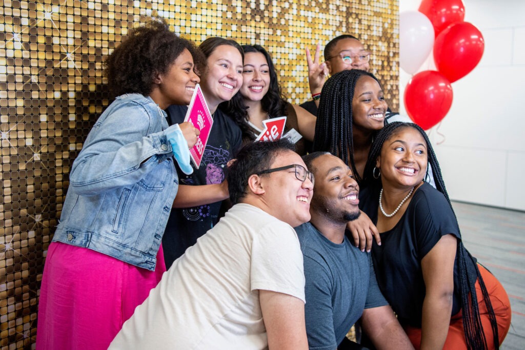 A group of students pose for a photo at the Multicultural Center grand opening.