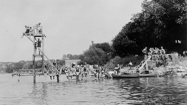 Students lounging on a pier on Lake Mendota