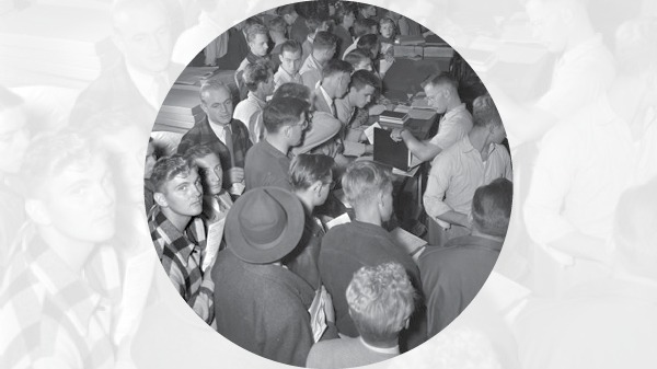 A crowd of students standing outside a bookstore