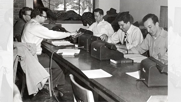 Students working on homework with calculation tools