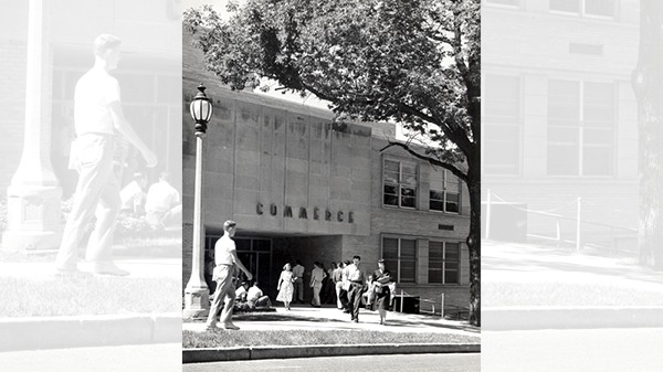 Students walking in front of the Commerce building