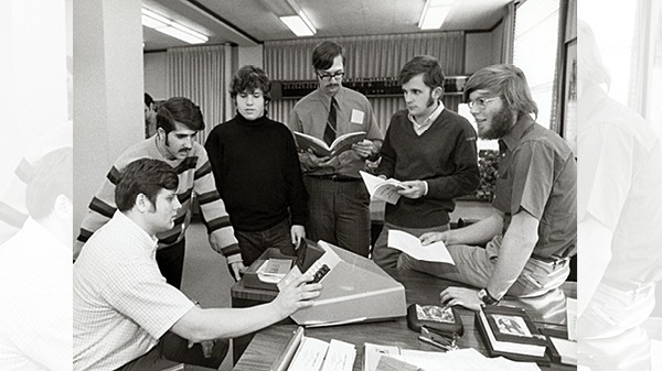 Six students working together on a type of investment tool