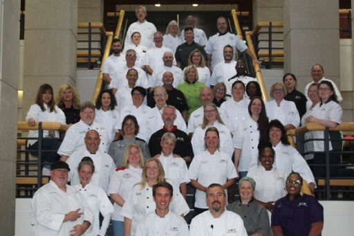 Chefs for Seniors franchise owners pose at Grainger Hall