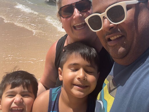 Saqib Mustafa with his wife and two boys at a beach