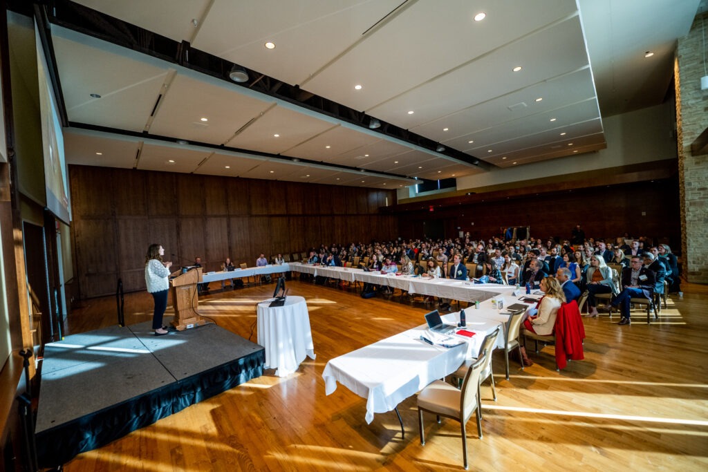 Kristin welcomes the crowd at the Marketing Summit