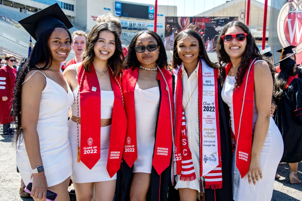 A group of WSB graduates celebrate during the commencement ceremony at Camp Randall.