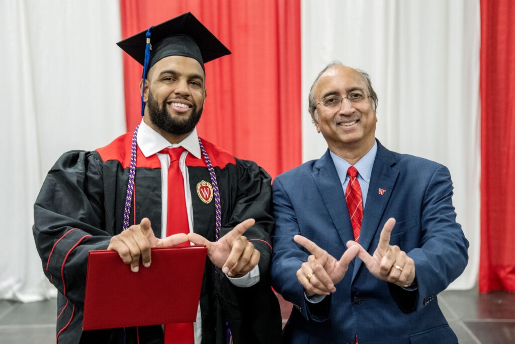 Wisconsin football player and WSB graduate Bryson Williams poses with Dean Vallabh Sambamurthy.