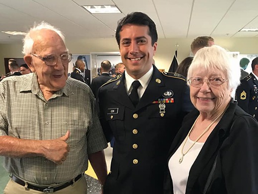James posing with his grandparents