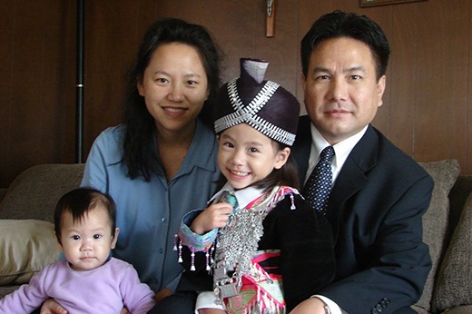 Family photo of Michelle as a child with 2 parents and a sibling
