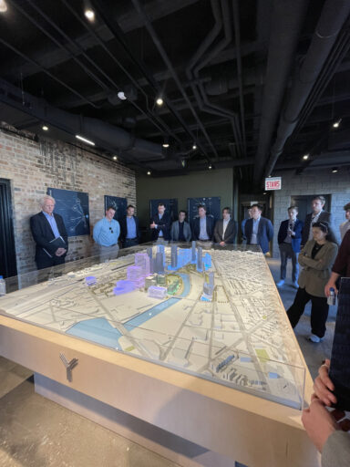 Students observing the model of Lincoln Yards